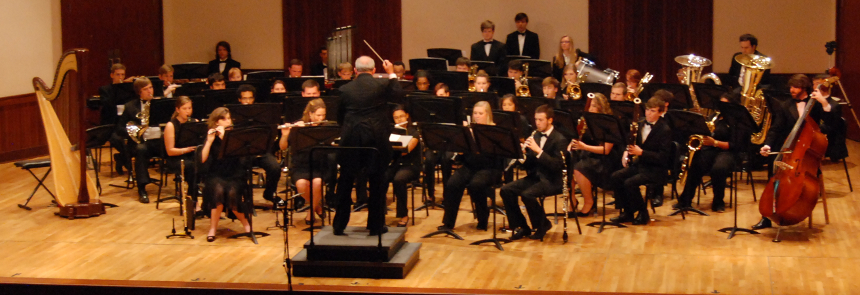 members of USA Wind Ensemble on stage during April performance