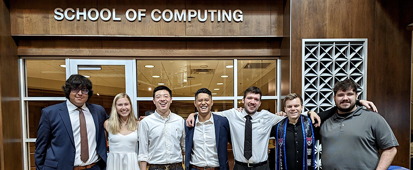 Undergraduate computer science students in front of the School of Computing Office