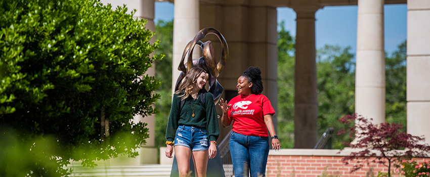 Students walking in front of Moulton Tower.