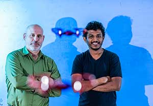 Professor with student with drone flying.