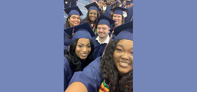 Smiling graduates at graduation.