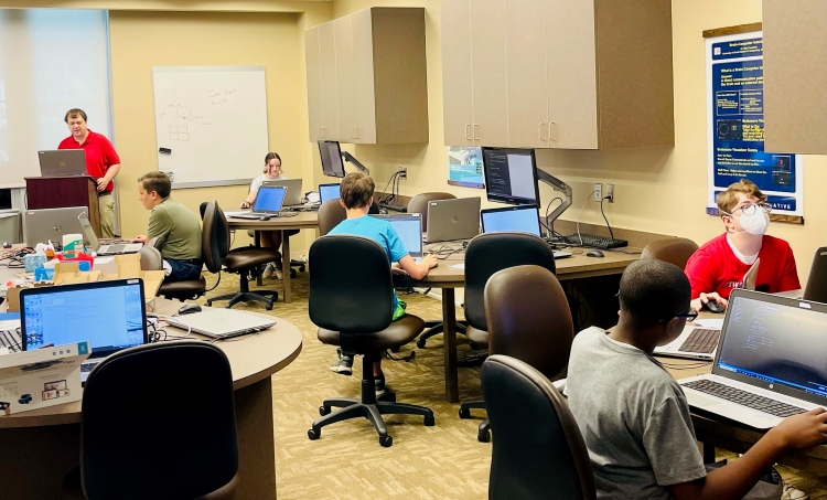 Mr. Keith Lynn helping students during the PACK camps