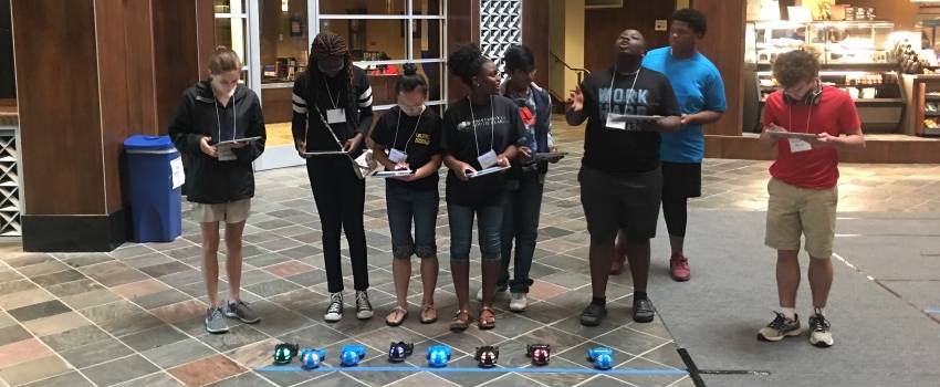 Students preparing to race robot cars data-lightbox='featured'