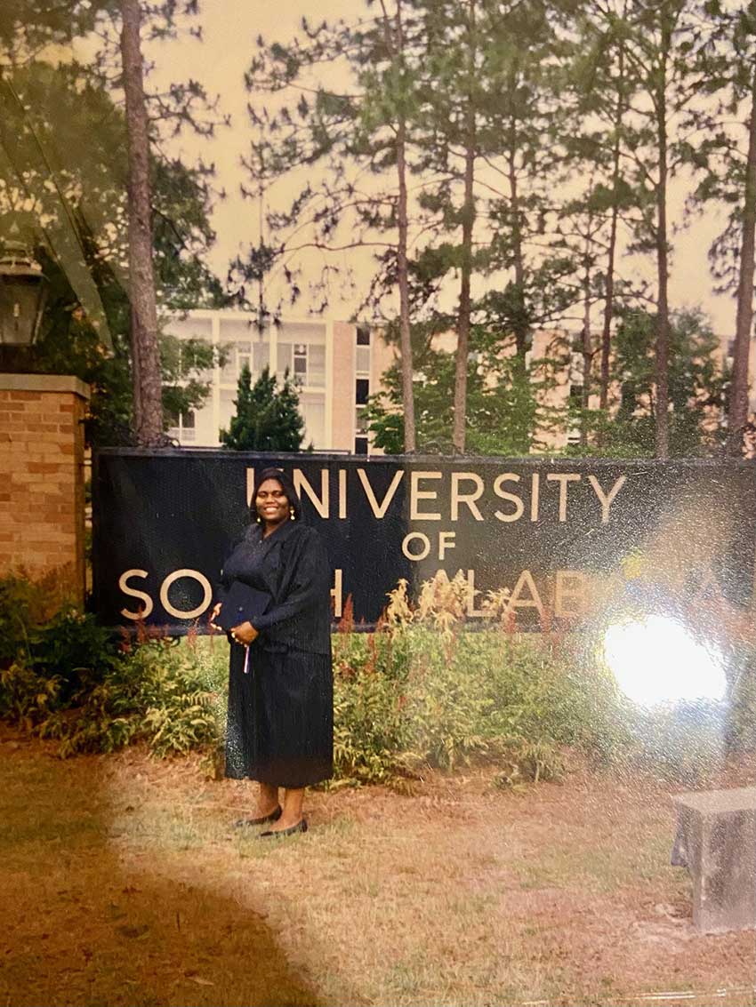 Rhonda Lucas in front of South sign