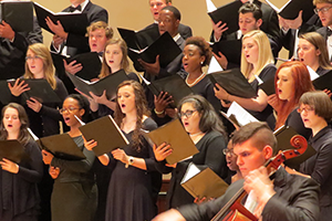 Students perfoming in the choir singing.