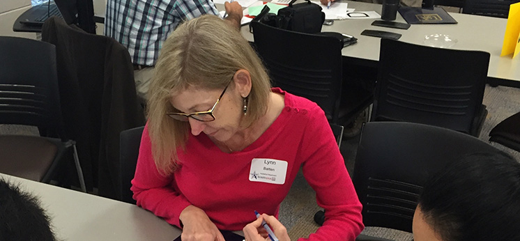 Woman writing in workshop