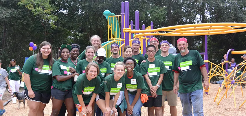 A group of students with professor at playground.