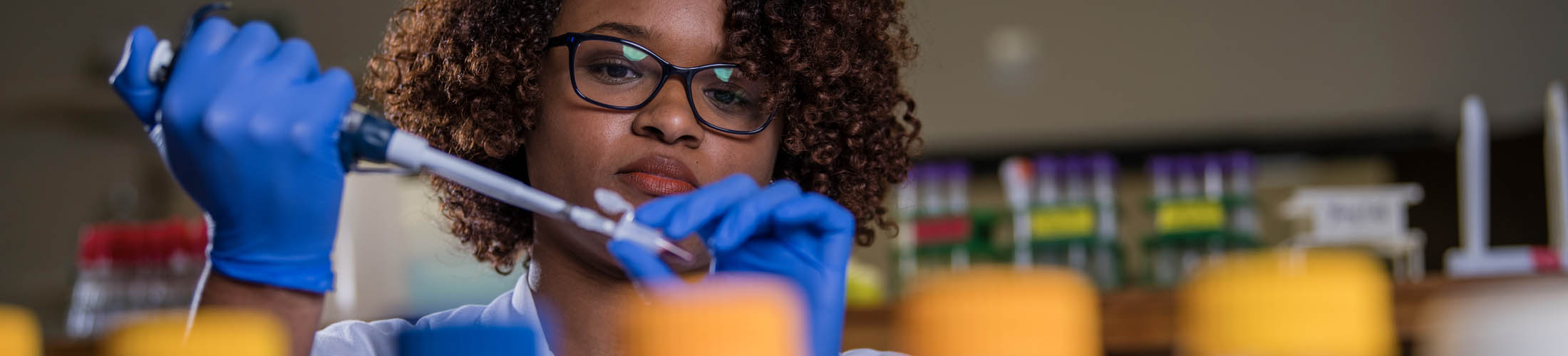 Female student working in lab.