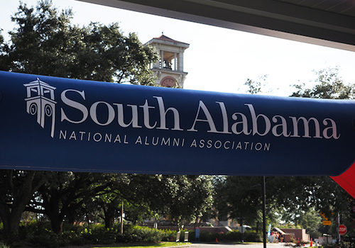 South Alabama National Alumni Association Banner with Moulton Tower in the background.