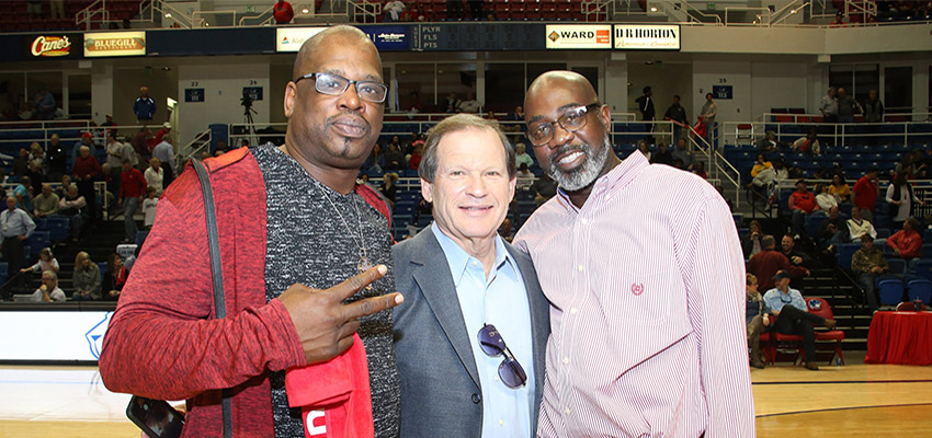 Junie Lewis’ (left) and Jeff Hodge’s jerseys were retired during halftime ceremonies at the South vs. Appalachian State game in January of this year. The players are shown here with their coach, Ronnie Arrow. data-lightbox='featured'