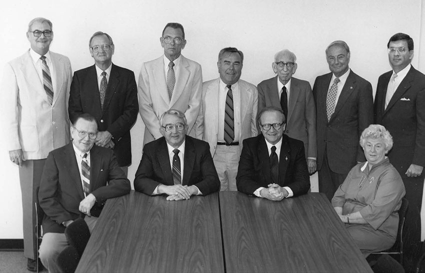 JOHN A. COUNTS SR., standing far right, becomes the first South alumnus to join the Board of Trustees. He serves until his death in 1995.