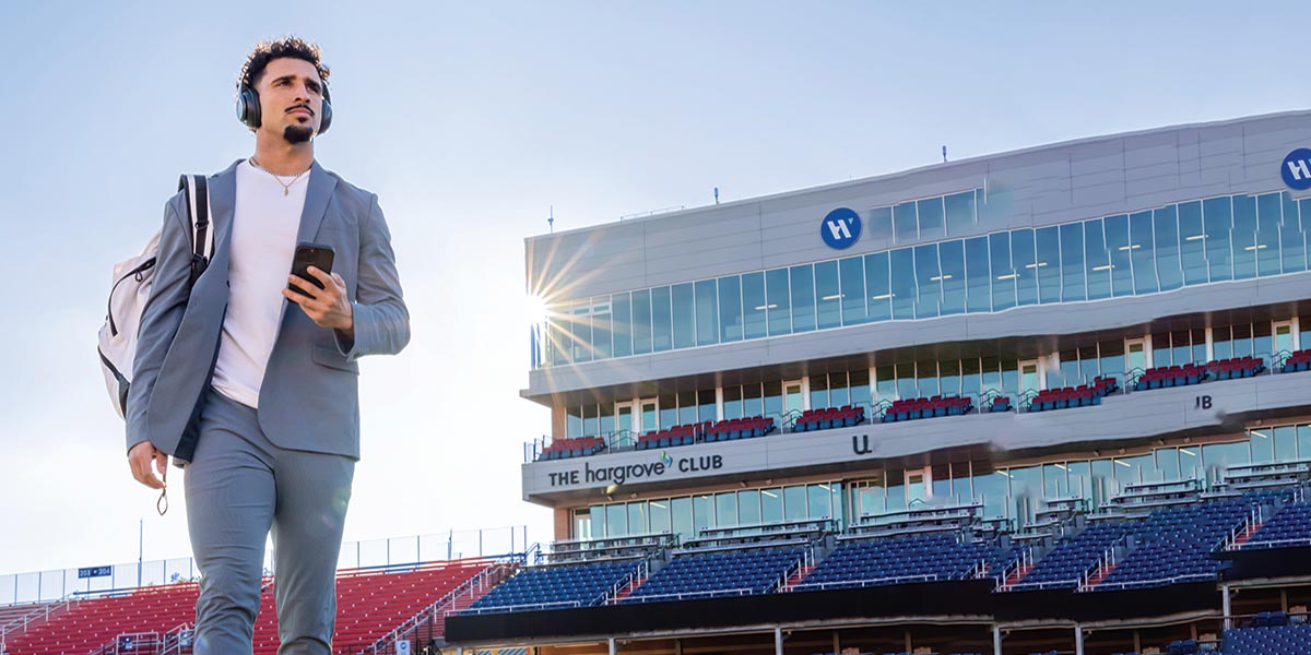 Devin Volsin walking on football field.