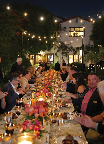 Alumni enjoying dinner at Evening Under the Stars event.