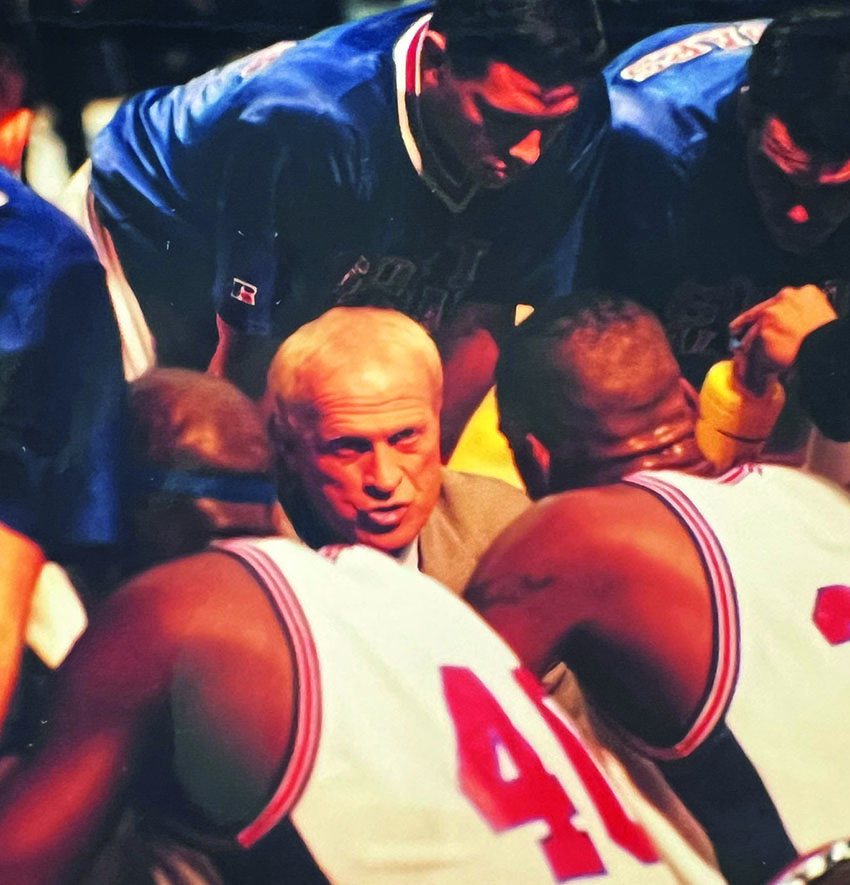 Coach Bill Musselman with basketball players.