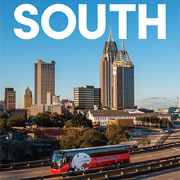 Cover of South Magazine showing a Jags bus on the interstate of downtown Mobile.