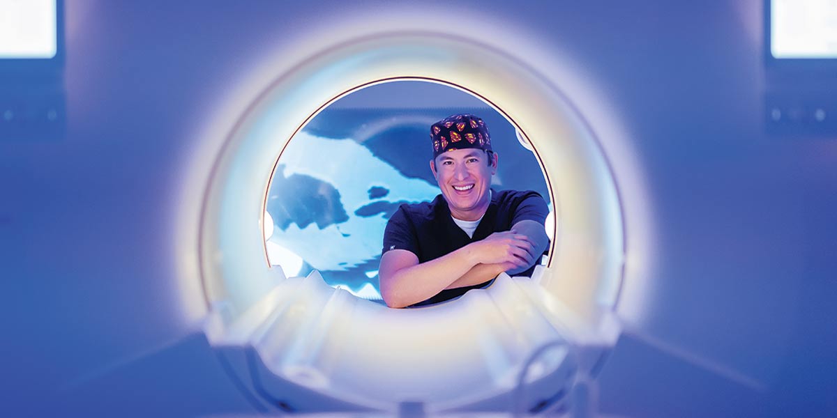 Dr. Kevin Wong with radiation machine.