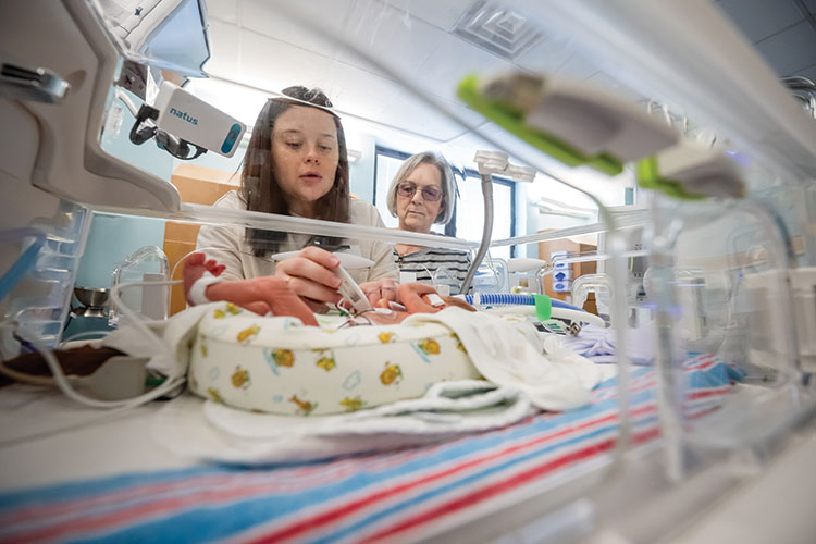 Small camera above each NICU bed allow parents to check in through a secure app
