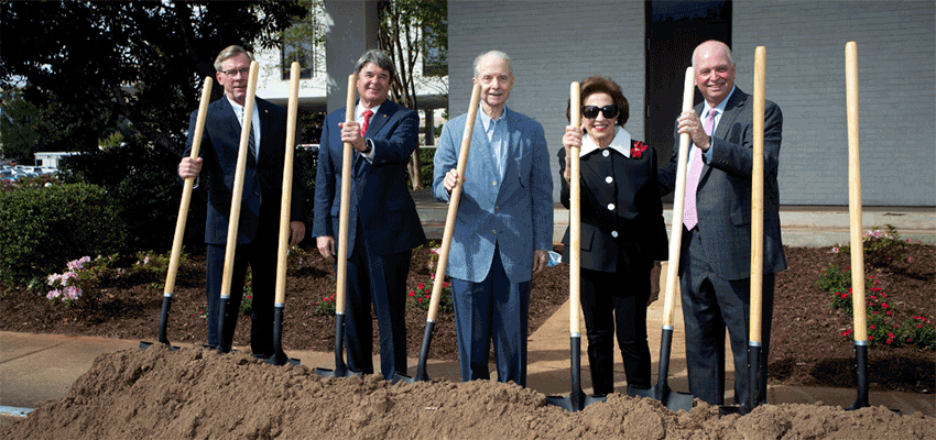 Board members holding shovels for ground breaking. data-lightbox='featured'