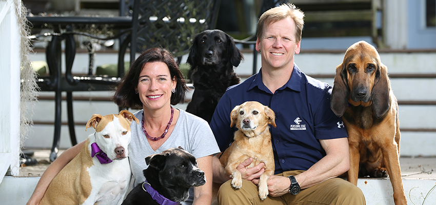 STEPHANIE EADS-WILLIAMSON and husband with dogs