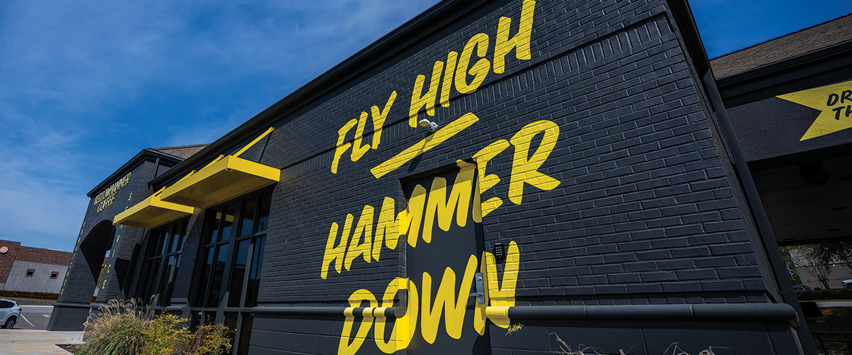 Yellow Hammer building - Fly High Hammer Down slogan