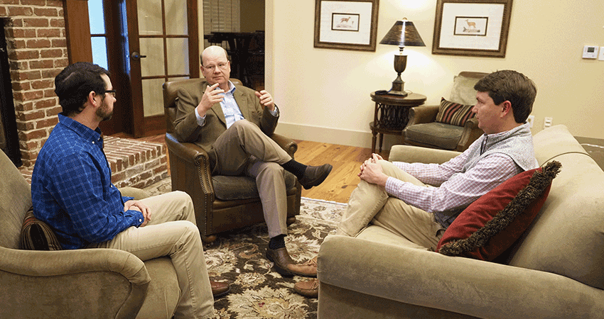 Marine Science professionals discussing in an office