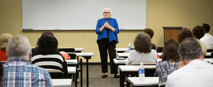 Professor teaching in front of class