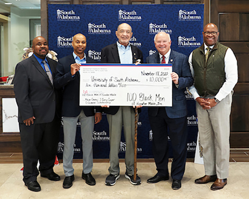 President Bonner, Dr. Mitchell, Dr. Greene, and member of 100 Black Men donating check to USA.
