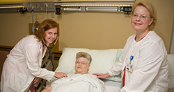 Patient in bed with doctor