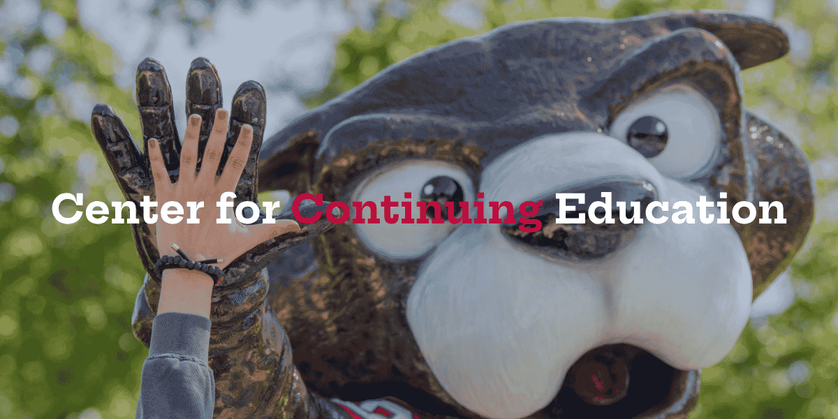 hand giving a high five to South Paw mascot
