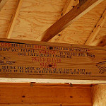Piece of wood in a house with words written on it