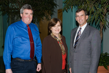 President Patrick Cahill is welcomed by Patricia Miles and Ker Ferguson.