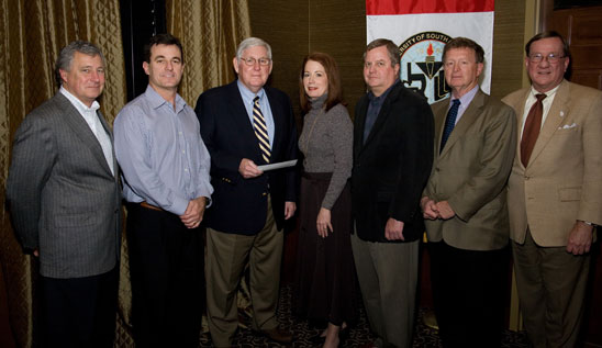 Budweiser-Busch Distributing Co. Inc. Presents Gift to USA Football Program -- From left at the presentation are: Budweiser-Busch Distributing Vice President and General Manager Mark Hughes; USA Head Football Coach Joey Jones; USA President Gordon Moulton; Budweiser-Busch Distributing Vice President Alexis Atkins; Budweiser-Busch Distributing Chief Executive and President Jim Fuchs; USA Athletic Director Joe Gottfried; and USA Vice President for Development and Alumni Relations Dr. Joseph Busta. 