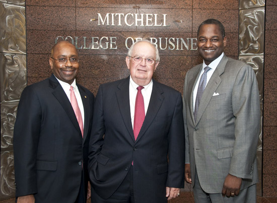 In this photo, Davis is welcomed to the University of South Alabama Mitchell College of Business. From left, RBC Bank Market Executive Cedric Hatcher, USA Mitchell College of Business Dean Dr. Carl Moore, and Davis