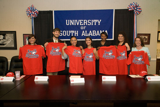 The University of South Alabama College of Education's first Pathway to Science Scholars show Jaguar pride following a ceremony in their honor.  The new Pathway to Science Scholarship Program will increase the number of science teachers in local schools by awarding major graduate scholarships to students with bachelor's degrees in science-related fields.  The new Pathway to Science Scholars are, from left: Candice Goff, Peter Kupfer, Elexisca Morriessette, Ashley Velazquez, Jeanell Calhoun, Alicia Butts and Tami May.