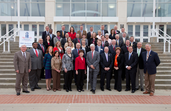 USA President Gordon Moulton, front row at left, stands outside the Mitchell Center with the charter members of the 50th Anniversary Annual Fund.