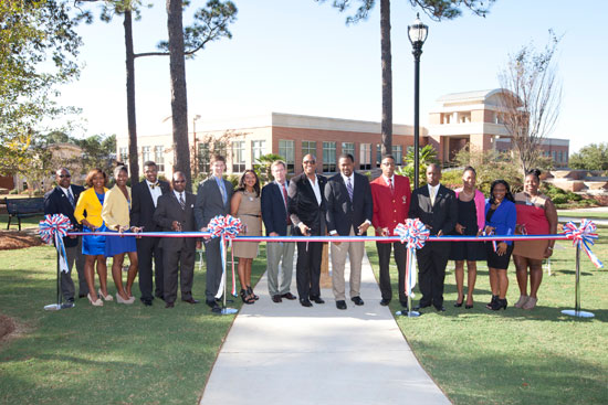 USA Announces New NPHC Park-The University of South Alabama National Pan-Hellenic Council Park, located east of the USA Bookstore and Meisler Hall at the old swimming pool site, was recently dedicated with more than 150 attending the ceremony. This new USA NPHC park pays tribute to nine historically African-American fraternities and sororities and their impact on Mobile and surrounding communities. From left, are Kenney Holder, Phi Beta Sigma Fraternity, Inc.; Felicia Smith, Sigma Gamma Rho Sorority, Inc., NPHC President Kierra Station; NPHC Vice President JaMarkus Coleman; Director of Multi-Cultural Student Affairs Dr. Carl Cunningham, Jr.; Student Government Association President Parker Chastain; Graduate Assistant NPHC Advisor Petre Freeman; Vice President for Student Services and Special Assistant to the President Dr. John W. Smith; Dean of Students Dr. Michael Mitchell; Antonio Birch, Omega Psi Phi Fraternity, Inc., Joshua Jackson, Kappa Alpha Psi Fraternity, Inc.,Tevin Warren, Alpha Phi Alpha Fraternity, Inc.; Nicole Watkins, Alpha Kappa Alpha Sorority, Inc.; Brittany Taylor, Zeta Phi Beta Sorority, Inc.; and Jasmine Holly, Delta Sigma Theta Sorority, Inc.