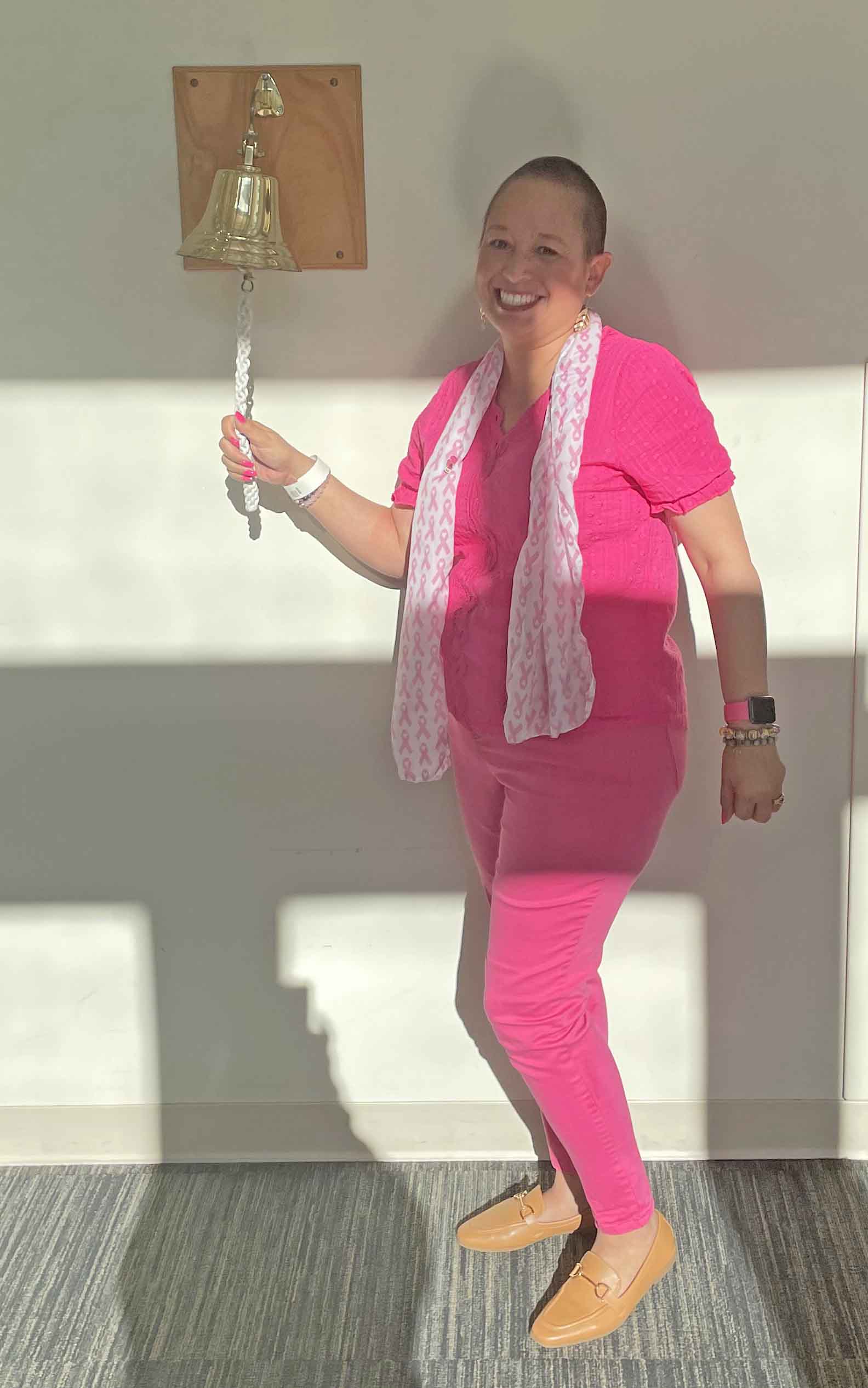 Woman wearing pink rings bell