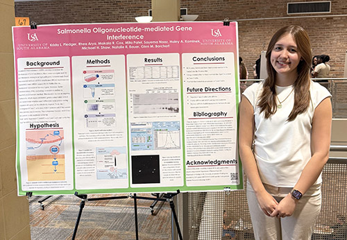 Student presents research poster