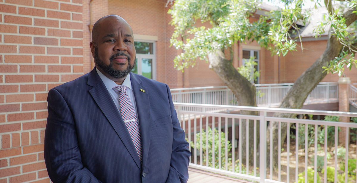 Dr. Andre Green, associate vice president of academic affairs and 100 Black Men of Greater Mobile president.