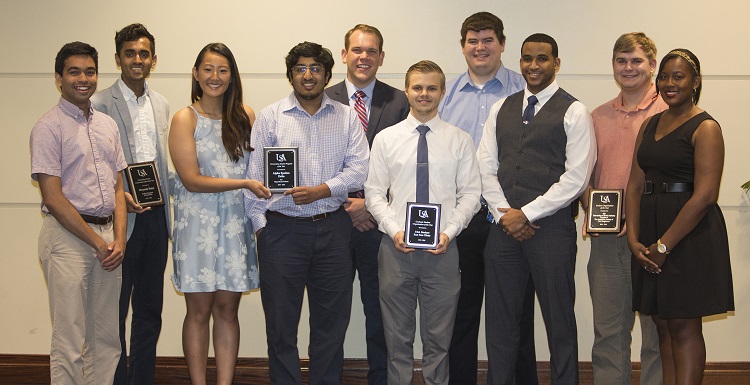 During the 2016 Student Organizations Leadership Awards luncheon, students were recognized for their outstanding service. Congratulating the award recipients are Ravi Rejendra, immediate past president of the Student Government Association, front row far left, and Ashley Ford, far right, SGA student-at-large member.