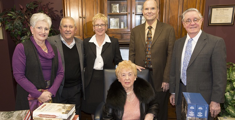 Agnes Tennenbaum, seated, the last known Holocaust survivor in Mobile, visited the USA Marx Library in 2014 for a donation to the Agnes Tennenbaum Holocaust Library Collection. Joining her, from left, Rickie Voit, co-chair, Mobile Jewish Film Festival; Tennenbaum’s son, Henry Schwarzberg and his wife, Diane; Dr. Richard Wood, dean, USA Libraries; and Jerry Darring, curator, Alabama Gulf Coast Holocaust Library. Tennenbaum died on Memorial Day.