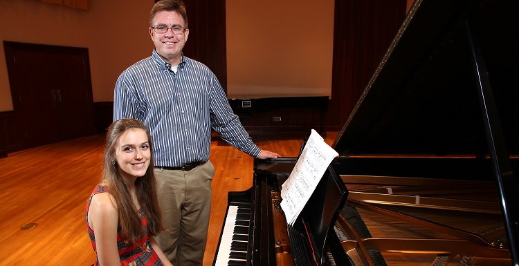 Dr. Robert Holm, professor of music at the University of South Alabama, has been teaching Natalie Newton piano lessons since she was 12.  data-lightbox='featured'