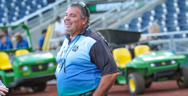 Dr. Joel Erdmann, on the field at TD Ameritrade Park before a game at the NCAA College World Series, has been USA's athletic director since 2009.