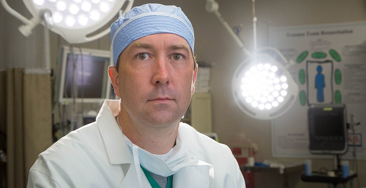 Dr. Jon Simmons, associate professor of surgery at the College of Medicine, balances being a trauma surgeon with an equally passionate curiosity for researching new ways to better treat patients.