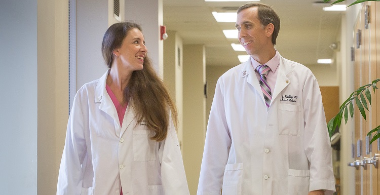 Drs. O. Grace Hundley and T.J. Hundley both applied as high school seniors to the College of Medicine's Early Acceptance Program. They met at South, married at South and work at South. data-lightbox='featured'
