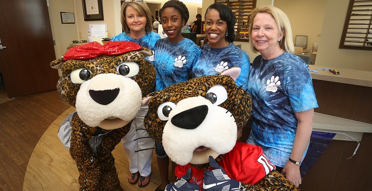 The South Alabama Student Health Center is ready for students to join them for the 2017 'Be Jag Healthy' Health and Wellness Day. From left are Valerie Heidel, supervisor clincial operations, Alexis Banks, president of the Jag Health Team, Feaunte' Preyear, coordinator of health education and quality improvement, and Beverly Kellen, practice director, with SouthPaw and Miss Pawla.