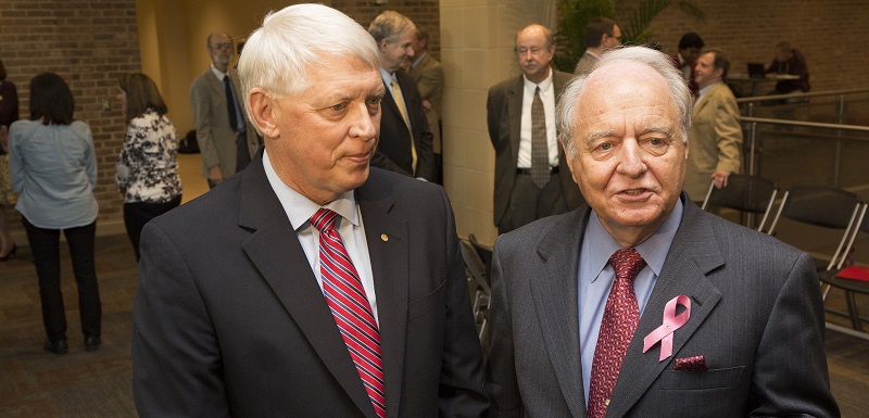 Dr. Tony Waldrop, USA president, left, and Dr. Christopher Puto, Spring Hill College president, announced a collaboration Thursday that will allow undergraduate students to register for courses at either institution. 