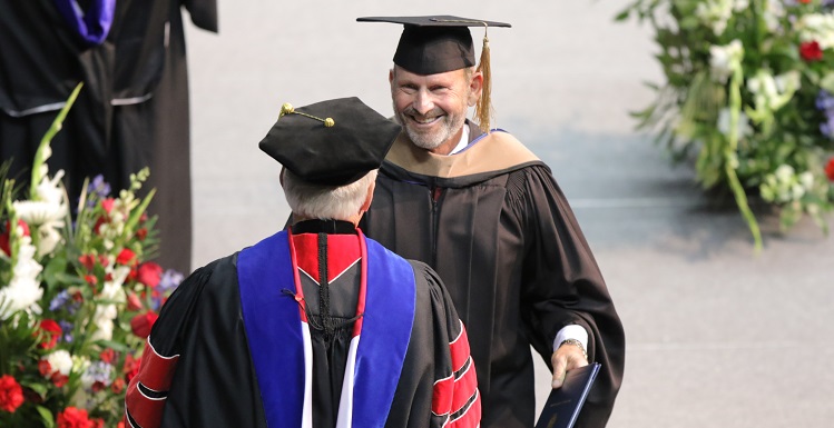 Retired Coast Guard Vice Admiral William "Dean" Lee's name was the first called Saturday as he led graduates from the College of Arts and Sciences to receive their degrees, then to shake hands with USA President Dr. Tony Waldrop. Lee graduated in 1979 but did not walk, "something I've always regretted." data-lightbox='featured'