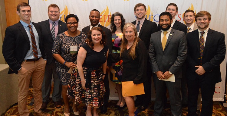 Dr. Krista Harrell, IFC adviser, second row, fourth from left, and Brendon Garrity, IFC president, second row, fifth from left, received second place among a record number of teams in the Student-Adviser category at the recent Southeastern Interfraternity Conference.  