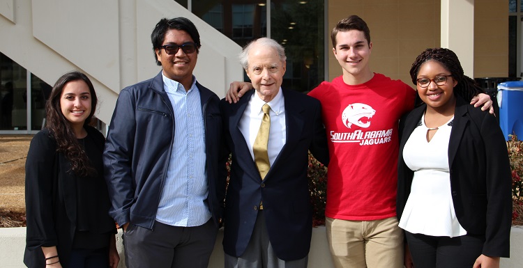 Abe Mitchell, whose gift created a $50 million matching scholarship initiative, meets with, from left, students Alexys Brown, Christian Manganti, Derek Rowan and Raven McShan.